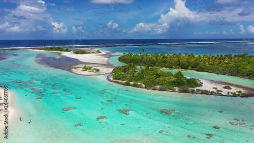 Rangiroa aerial drone video of atoll island motu and coral reef in French Polynesia, Tahiti. Amazing nature landscape with blue lagoon and Pacific Ocean. Tropical island paradise in Tuamotus Islands. photo