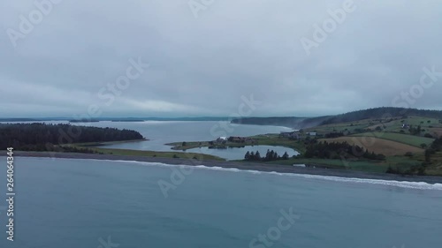 Wallpaper Mural Cinematic drone / aerial footage moving sideways showing a forest, farms, the ocean and a few chalets in Kingsburg, Nova Scotia, Canada during summer season. Torontodigital.ca