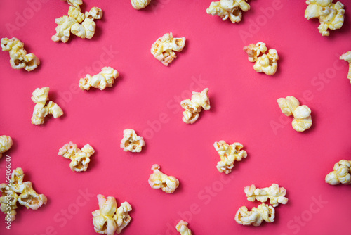 Popcorn pattern on red background on top view / Sweet butter popcorn