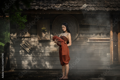 Woman Ghost drama and carrying her baby ghost standing on old thai house / Horror Legend of Mae Nak Phra Khanong
