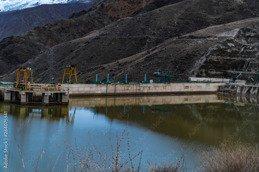 Fototapeta premium Hydropower dam in the middle of the mountains