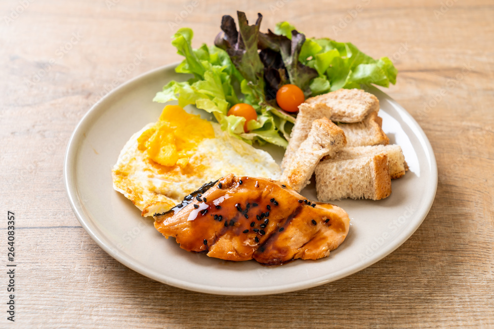 salmon teriyaki steak with fried egg and salad salmon teriyaki steak with fried egg and salad