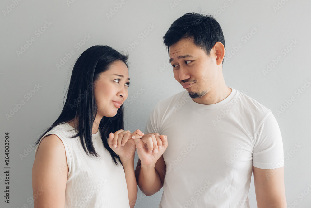 Sulk and reconcile couple lover in white t-shirt and grey background. Sulk and reconcile couple lover in white t-shirt and grey background.