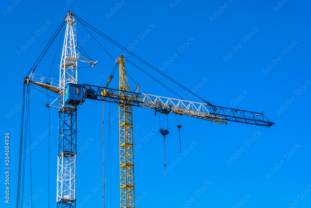 Cranes on a background of blue sky Cranes on a background of blue sky