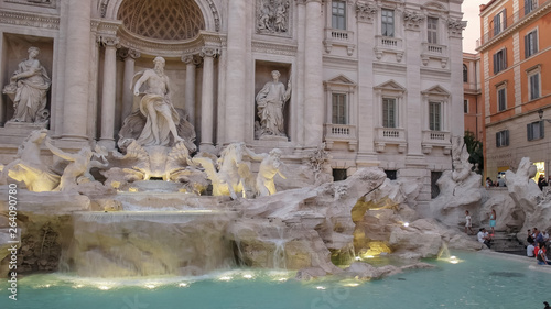 evening shot of a floodlit trevi fountain in rome