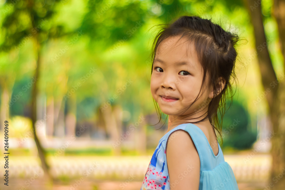 Close-up portrait of smiling beautiful little girl in a summer green park. Close-up portrait of smiling beautiful little girl in a summer green park.