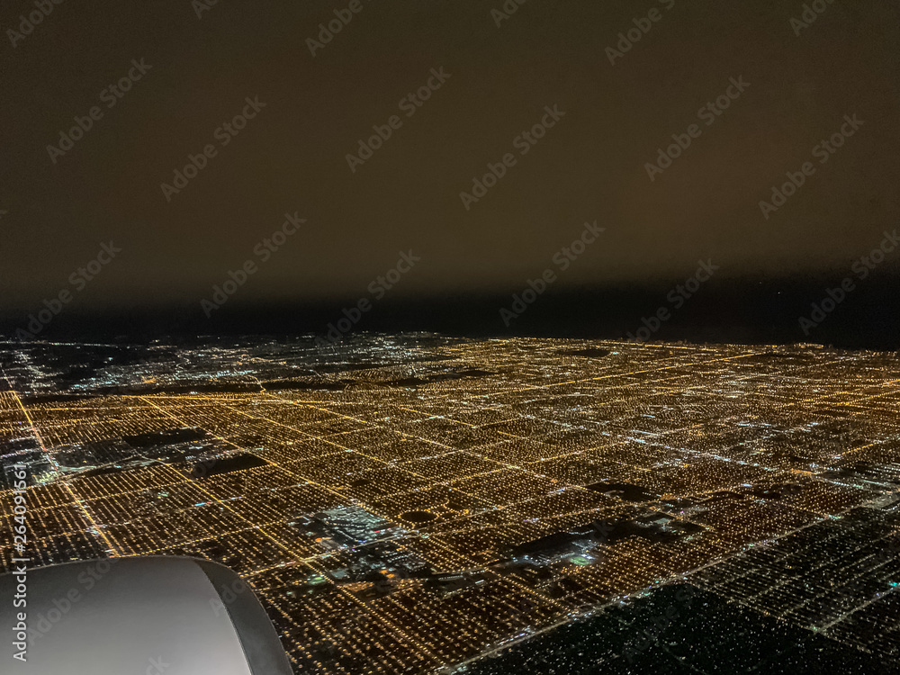 custom made wallpaper toronto digitalView of Chicago's illuminated city night lights seen through the window of an airplane