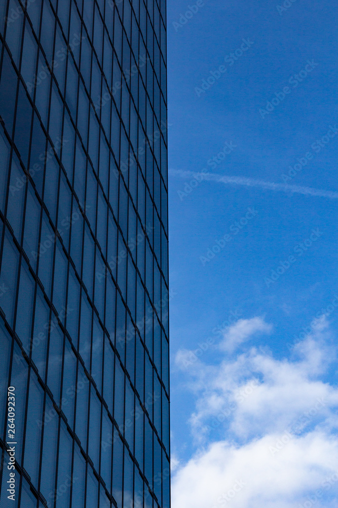 sky and clouds reflected in windows of modern building sky and clouds reflected in windows of modern building