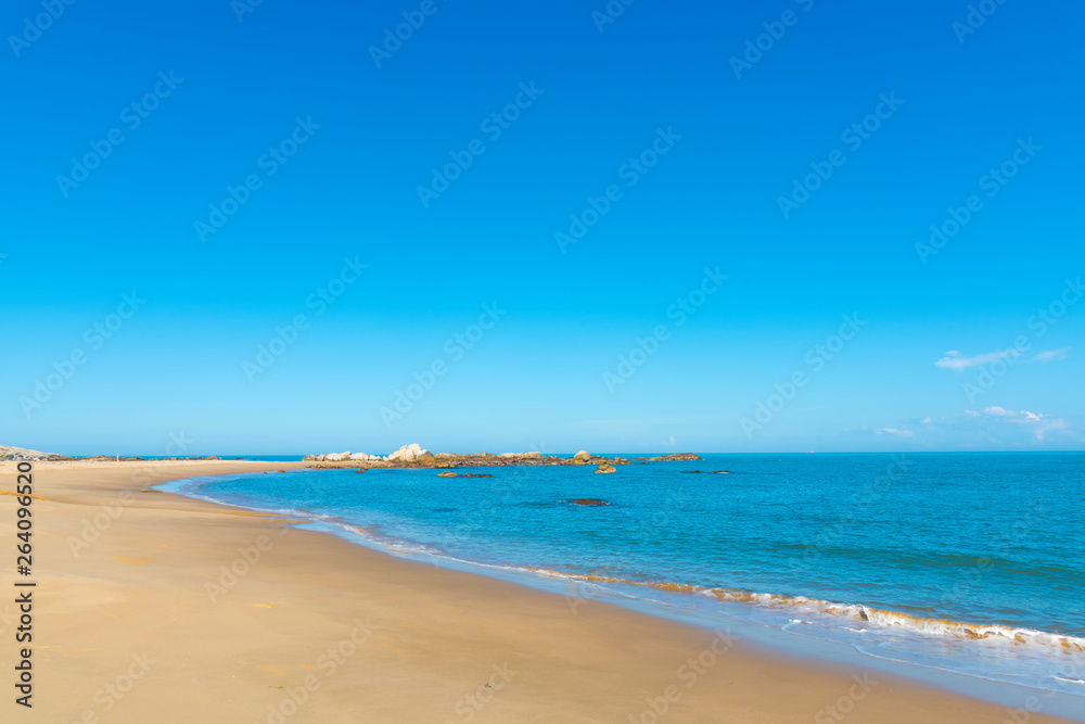 white beach, clear sea and blue sky