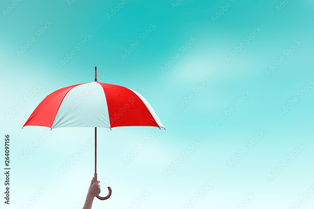 Protection concept: hand holding rainbow umbrella distinctively unique 