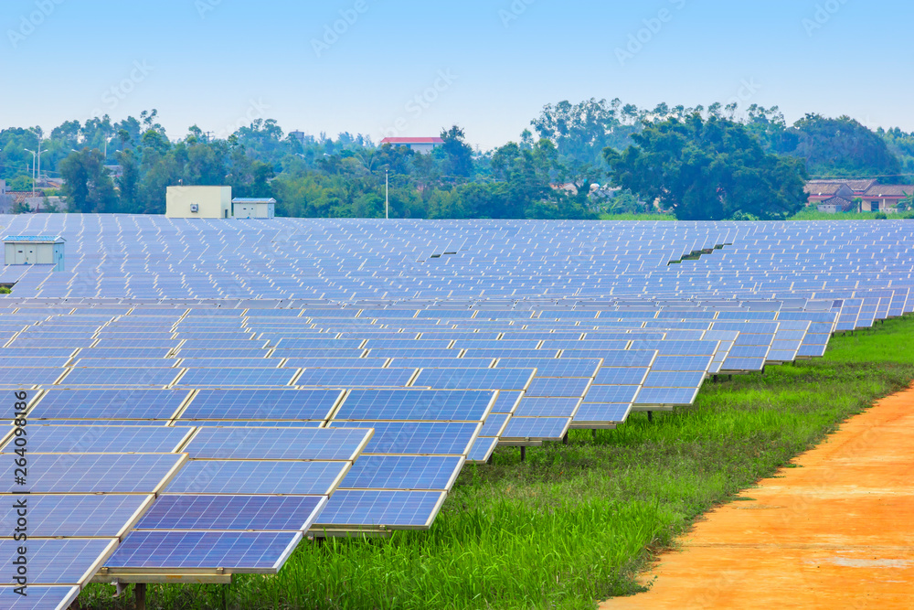Solar power and photovoltaic panels under the blue sky white clouds.