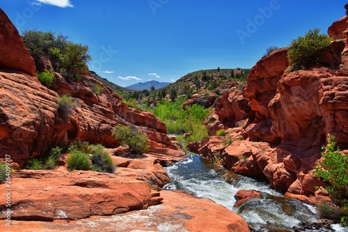 Views of Waterfalls at Gunlock State Park Reservoir Falls, In Gunlock, Utah by St George. Spring run off over desert erosion sandstone. United States. photo