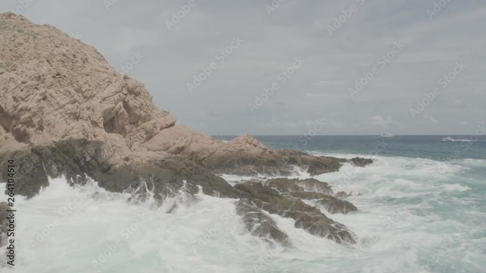 Small cove being crashed by the waves of the sea Small cove being crashed by the waves of the sea