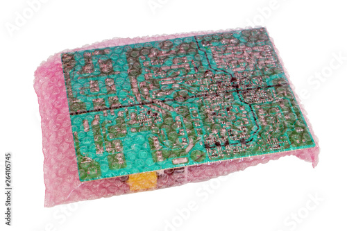 Spare parts and electronic circuit boards  packed in soft red  film with air bubbles