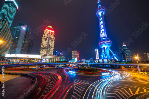 The Oriental pearl tower and the Shanghai night traffic light trails in the heart of the city
