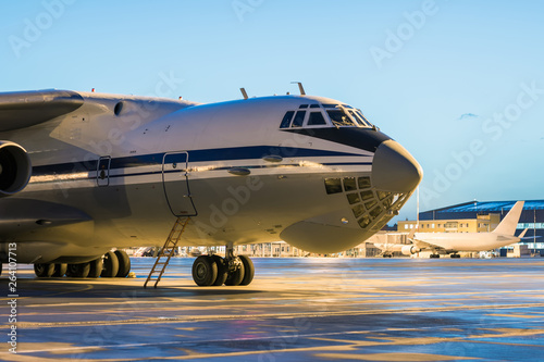 Close-up big cargo airplane at the airport apron in the early morning