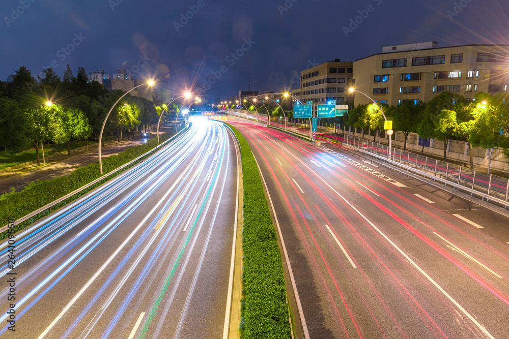 The cars on the highway light trails in Shanghai, China The cars on the highway light trails in Shanghai, China