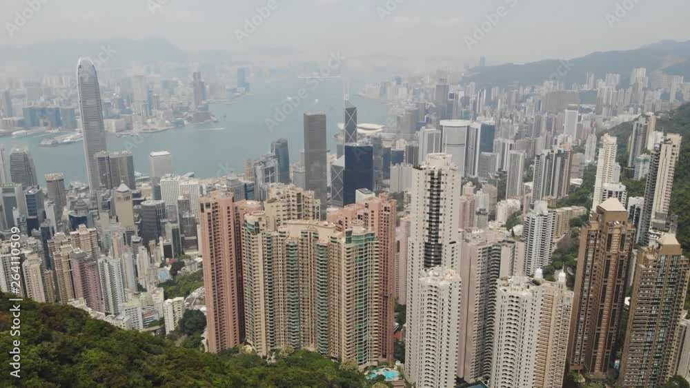 Victoria Harbor aerial view with Hong Kong skyline and urban skyscrapers in the day. Victoria Harbor aerial view with Hong Kong skyline and urban skyscrapers in the day.