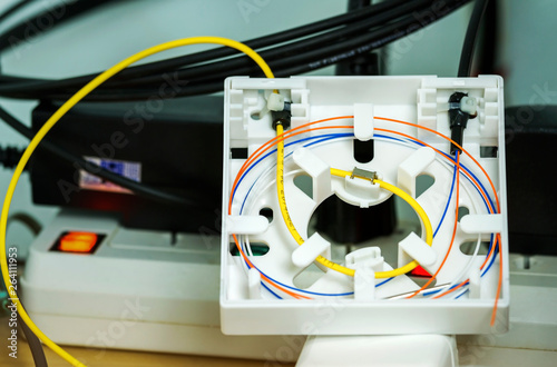 Fiber optic splicing with protection sleeve and blue fiber installed in optical terminate box for Passive optical network or Fiber to the home photo