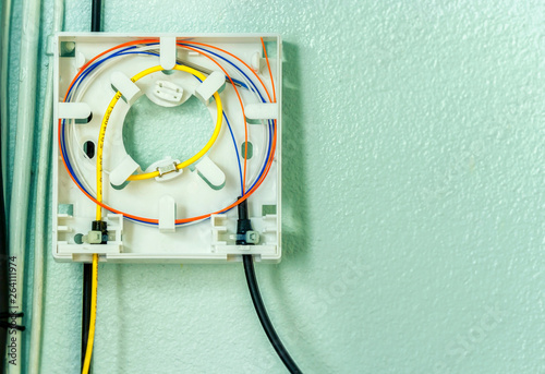 Konstfotografi Fiber optic splicing with protection sleeve and blue fiber installed in optical