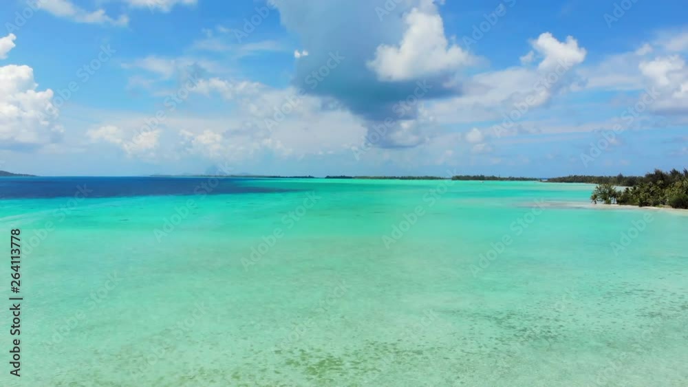 Aerial Ascend: Vibrant Blue, Tropical, Sunny Ocean Out To Horizon in Vahine, French Polynesia Aerial Ascend: Vibrant Blue, Tropical, Sunny Ocean Out To Horizon in Vahine, French Polynesia