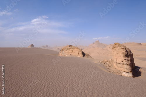 Sand, rocks and blue sky in the Kalut Shahdad Desert, Kalouts, Shahdad, Iran