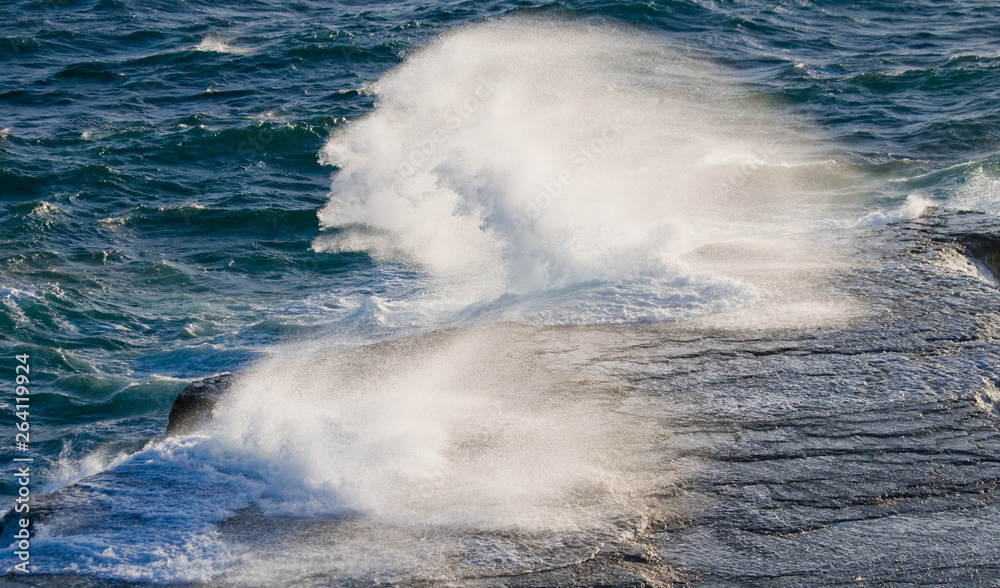 The coastline on the Peninsula Valdes. Waves crashing against the rocks. Argentina. South America