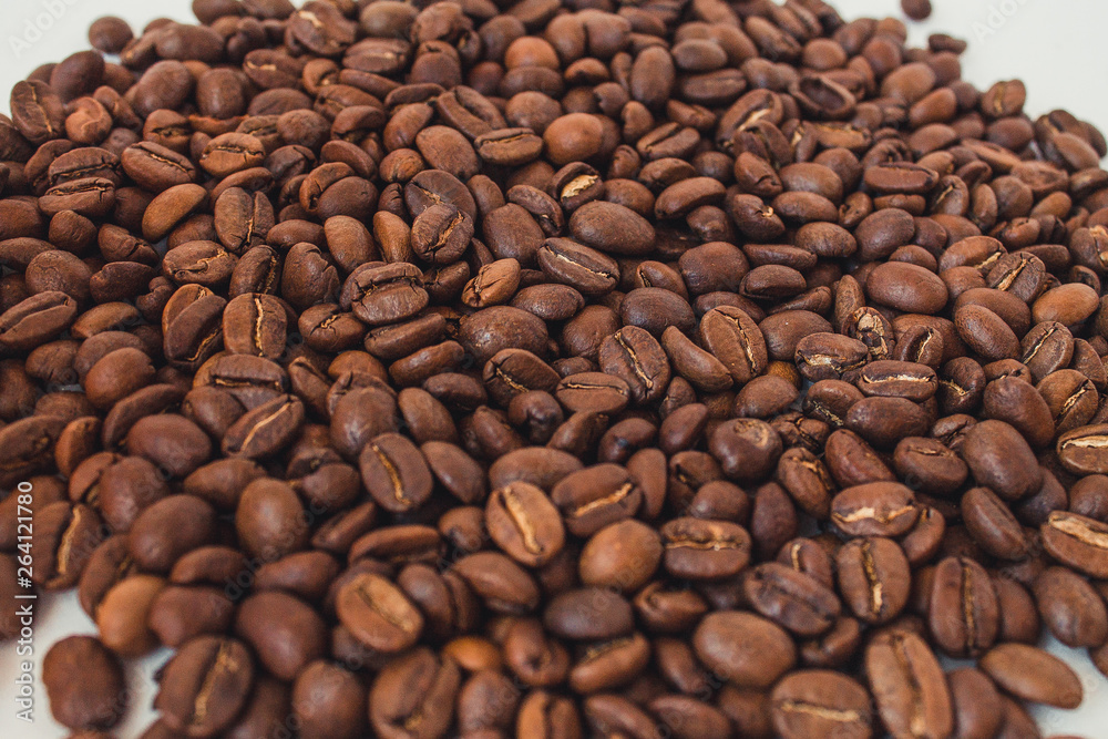 Fototapeta premium Background of coffee beans. Coffee is on the table