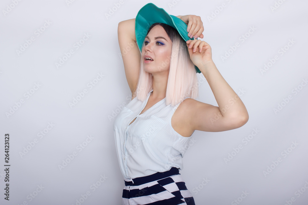 Beautiful blonde woman in green hat Beautiful blonde woman in green hat