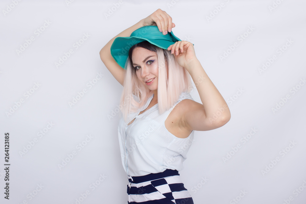 Beautiful blonde woman in green hat