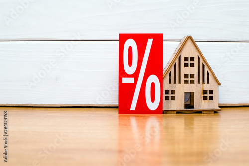 House symbol on a white wooden background 