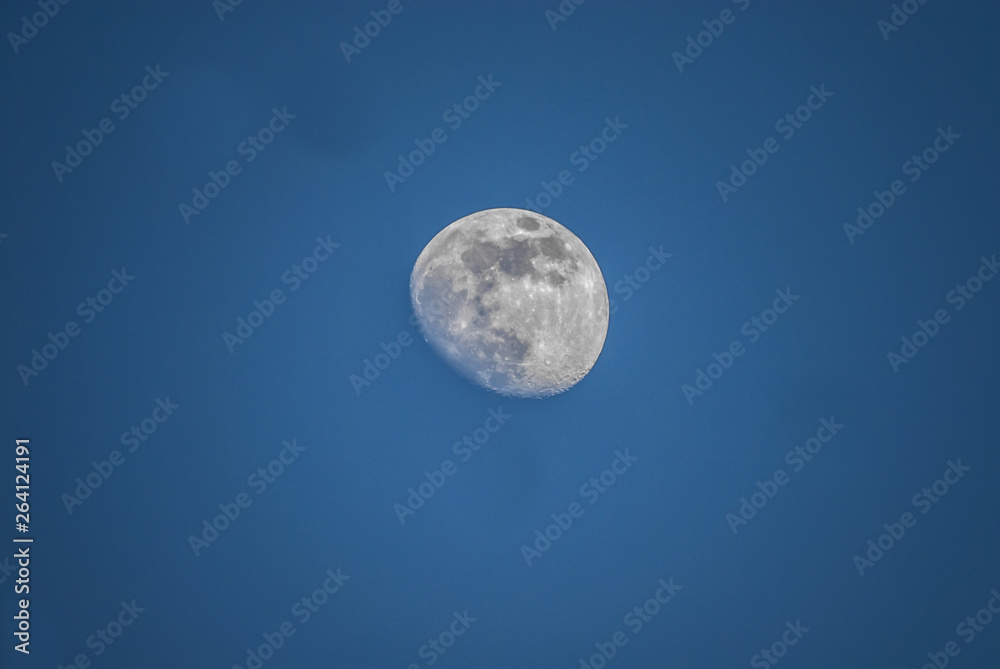 moon in the sky during the day