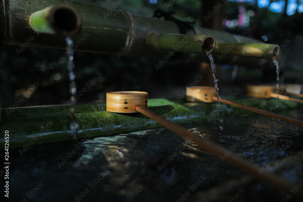 Water from bamboo and Water bamboo bowl for cleaning hand and mouth before worship in temple and shrine in Japan. Water from bamboo and Water bamboo bowl for cleaning hand and mouth before worship in temple and shrine in Japan.
