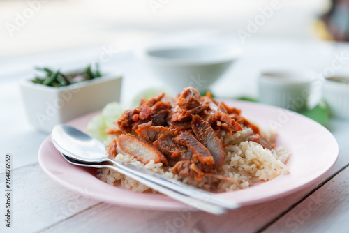 Barbecued red pork in sauce with rice