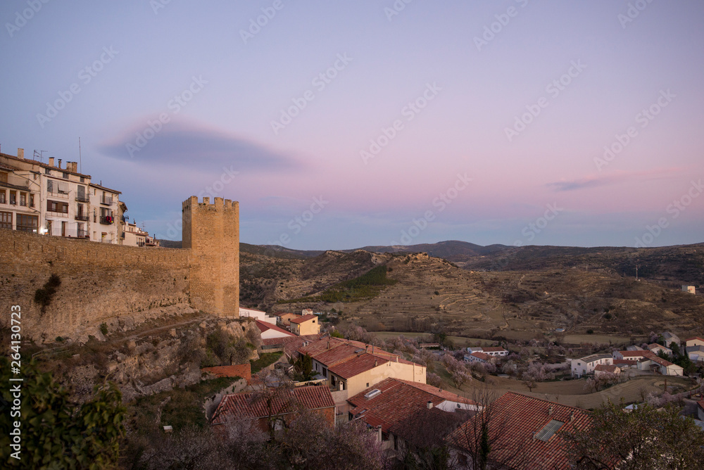 The walls of Morella in els ports during sunset
