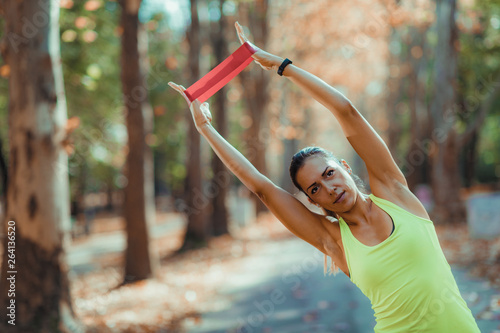 Woman Exercising with Resistance Band