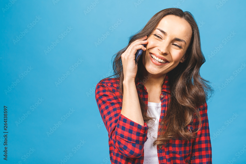 Isolated over blue portrait of young woman phone call. Isolated beautiful girl. Talking mobile phone woman. Isolated over blue portrait of young woman phone call. Isolated beautiful girl. Talking mobile phone woman.