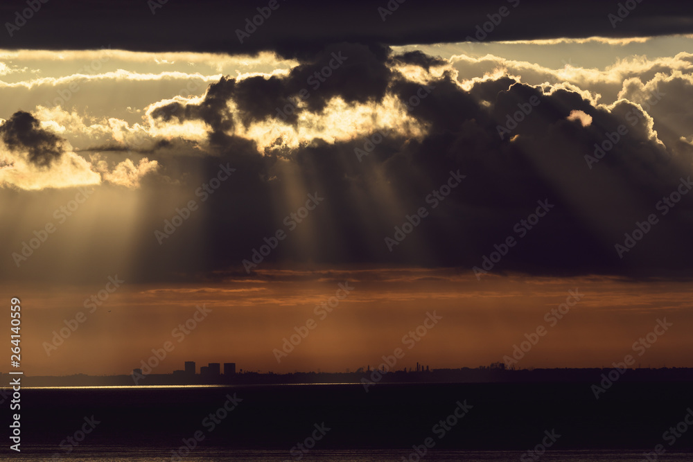 Dramatic sunrise over the  Los Angeles skyline with light rays