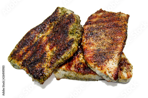 Obraz na płótnie Grilled steaks with spices on white background, isolated w salonie