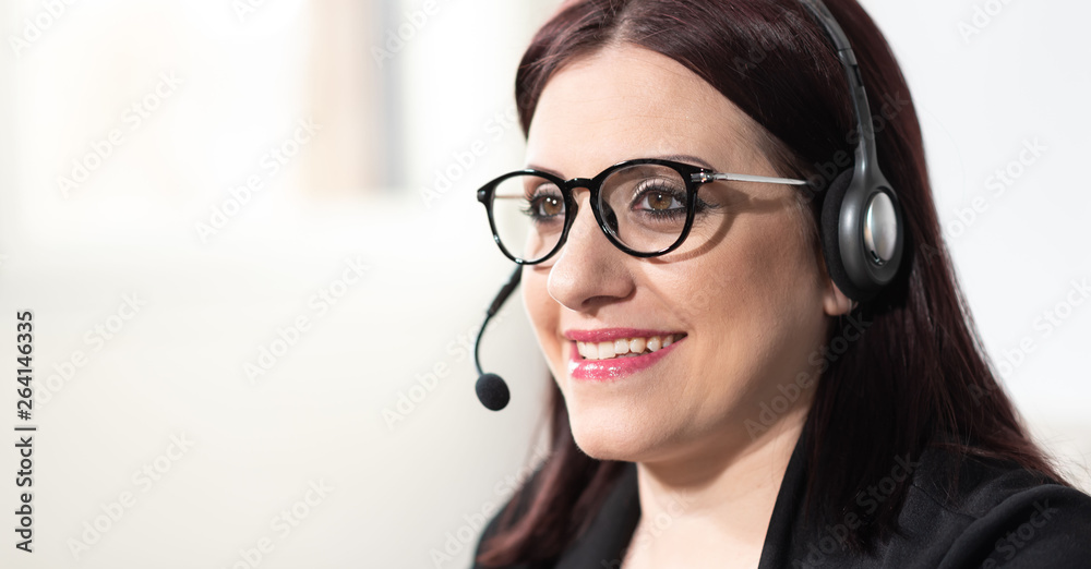 Portrait of female phone operator with headset