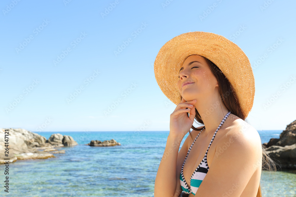 Tourist with closed eyes enjoying beach vacation