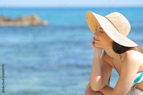Relaxed sunbather enjoying vacation on the beach