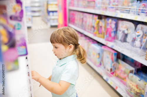 RUSSIA, Moscow. July 03, 2018. Little kid girl shopper having fun at the toy shop