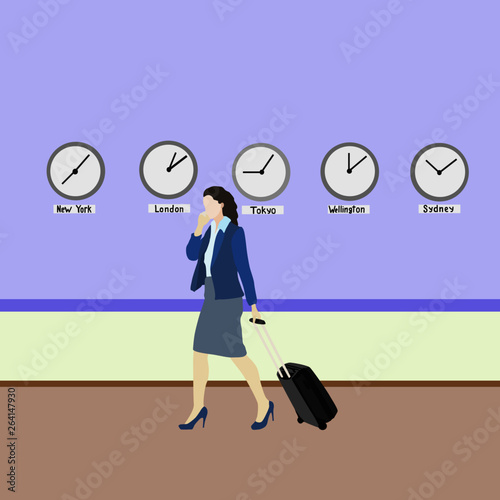 An airplane travel woman goes past the clock that depicts different hours in different big cities around the world