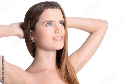 Portrait of beautiful young woman posing on white background