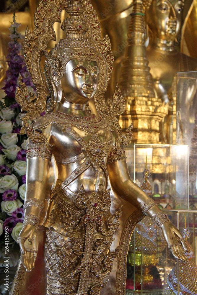 statue of buddha in a buddhist temple (Wat Phra That Haripunchai) in Lamphun (Thailand)
