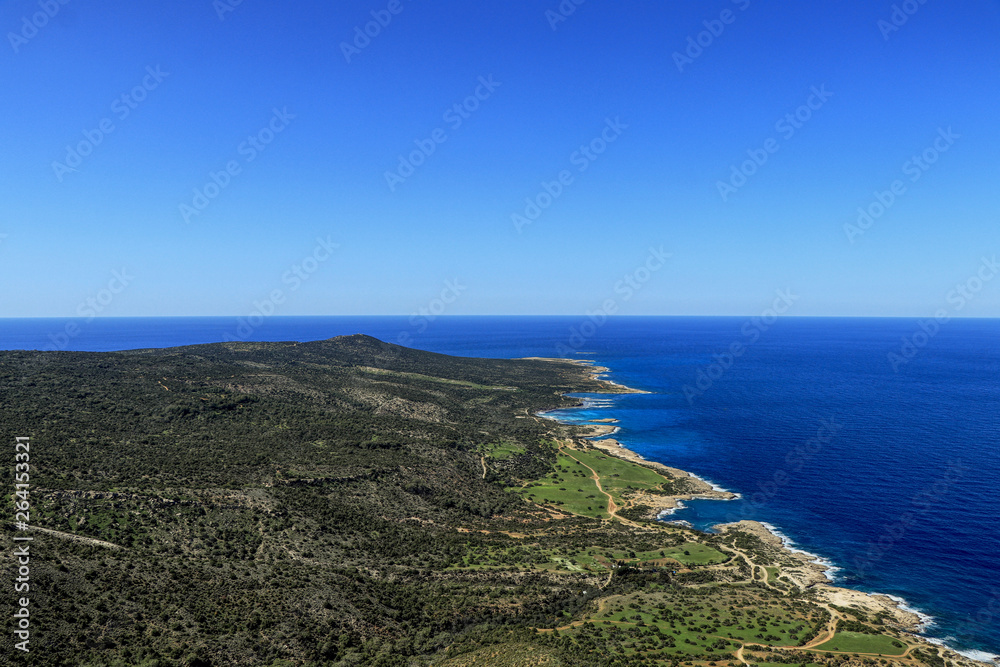 Incredible view on mediterranean sea in Akamas Peninsula National Park, Cyprus. Blue sky with green park on the north part of cyprus island. Travellers are enjoy this outlook from rock hill