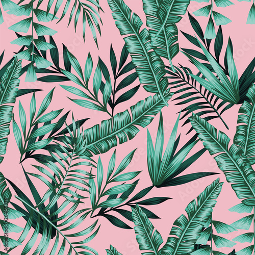 Exotic green tropical leaves seamless pattern pink background