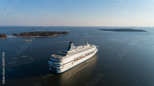 Photography Aerial view of cruise liner sailing in the open sea at sunset