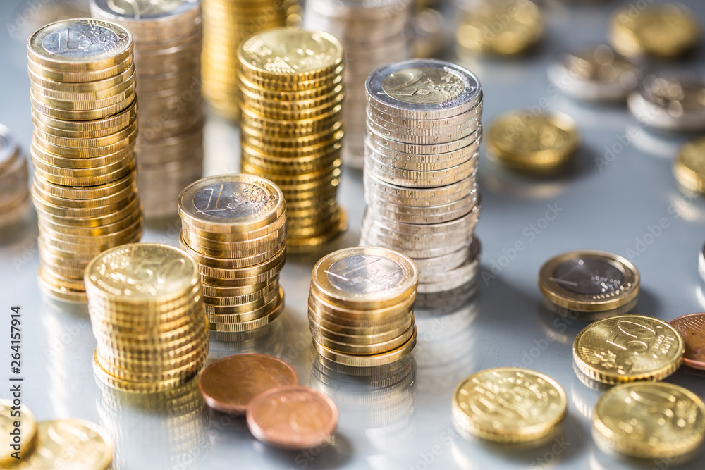 Towers of the euro coins stacked in different positions Towers of the euro coins stacked in different positions
